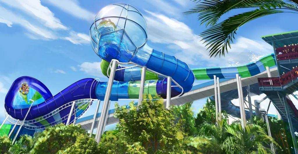 Tobogán acuático azul y verde en parque de diversiones