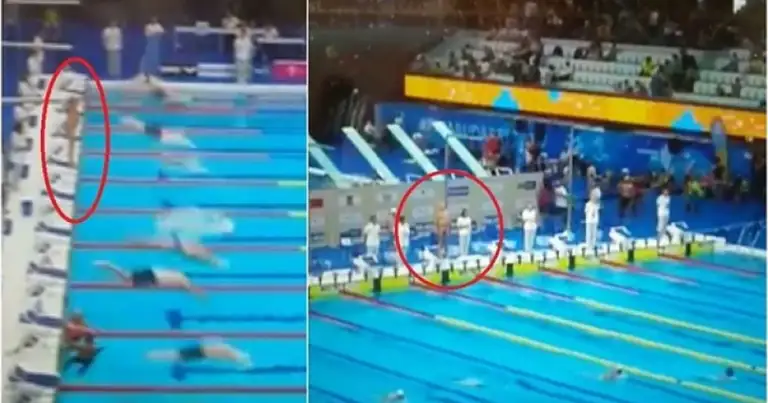 Nadador compitiendo en una piscina olímpica de competencia