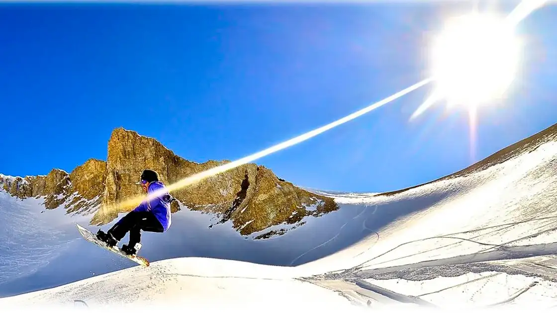 Las Leñas: esquiador saltando en medio de la nieve