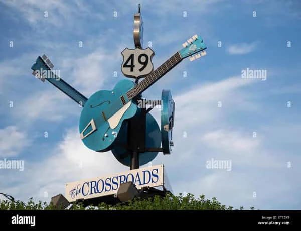 Escultura de guitarra turquesa número 49 con cartel Crossroads